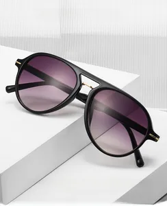 Detail view of aviator computer safety glasses with purple gradient lenses and gold accents