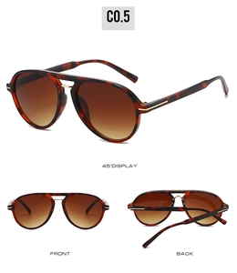 Detail view of aviator sunglasses with tortoise frame, gold double bridge and gradient lenses