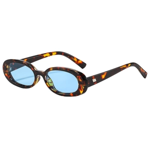 Retro oval tortoiseshell sunglasses with light blue lenses and silver metal temple detail