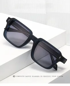 Macro detail of square black frame sunglasses featuring decorative metal rivets on the side