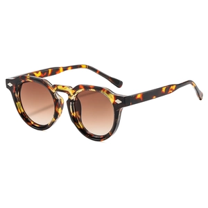 Vintage round tortoiseshell sunglasses with brown gradient lenses shown in a 45-degree angle