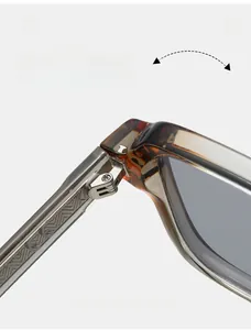 Macro detail of tortoiseshell sunglasses featuring durable metal hinges and textured temple tips