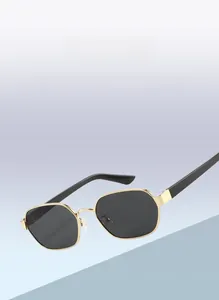 Detailed view of lightweight golden hexagonal metal frame sunglasses with black lenses