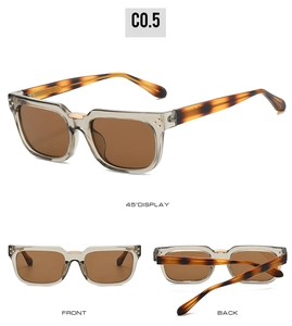 Vues détaillées de lunettes de soleil en acétate gris avec branches écaille avec accents dorés et verres bruns