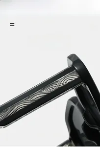 Macro detail of black acetate temples with silver engraved metal core texture