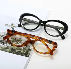 Detail of cat-eye frames with heart-shaped metal accents and tortoiseshell finish