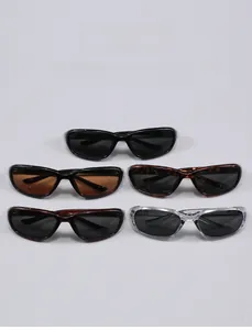 Close-up of five Y2K slim wrap-around sports sunglasses in various colors and frames