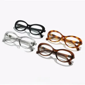 Detail view of TR8057 cat-eye glasses frames showing multiple colors and model engraving