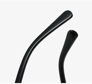 Macro view of rounded temples on classic black TR90 eyewear frames with glossy finish