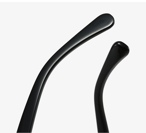 Detailed macro view of smooth ergonomic black temple tips of cat eye glasses
