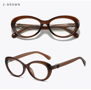 Detail view of brown oval cat-eye frames with heart accent and side temple specs