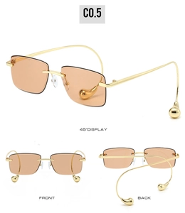 Drei-Winkel-Ansicht der rahmenlosen Sonnenbrille mit Goldgestell und bernsteinfarbenen Gläsern