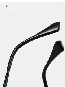 Detailed close-up of glossy black ergonomic sunglasses temples with a sleek polished finish