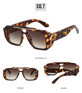 Détail des lunettes de soleil carrées à double pont avec motif écaille et protections