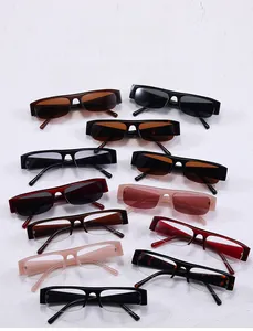 Flat lay of diverse rectangular half-frame and full-frame sunglasses in multiple colors