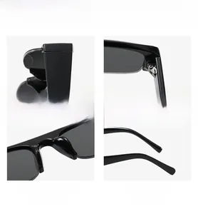 Detail of wide textured legs, strong hinges and nose pads on black fashion sunglasses
