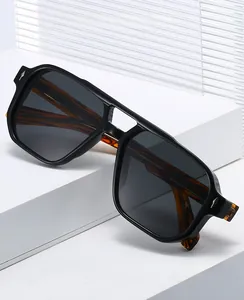 Detail of matte black aviator sunglasses with tortoise shell temples on display stand