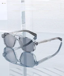 Close-up of matte grey pilot sunglasses with engraved metal core in the temple