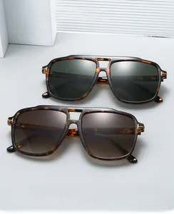 Detail of pilot sunglasses with tortoiseshell frames and metal T-shaped hinges