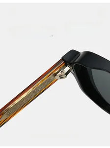 Macro detail of high-quality durable metal hinge and texture on acetate aviator sunglasses