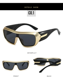 Detail view of futuristic wrap-around sports sunglasses with sleek gold trim and dark lenses