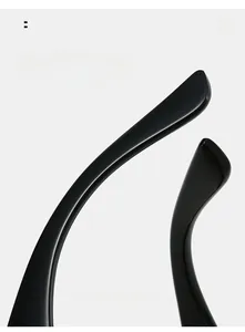 Detailed macro view of black ergonomic curved mirror legs for comfortable eyewear fit