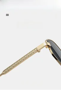 Detailed macro view of light gold metal sunglasses frame with luxury diamond texture