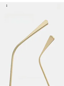 Close-up of curved golden metal temples showing arc comfortable wear design