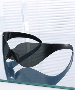 Close-up of sleek black Y2K oversized rimless sunglasses with cyberpunk aesthetic