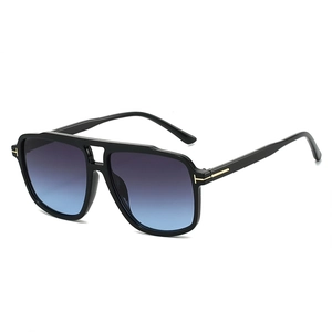 Classic black pilot sunglasses with blue gradient lenses and golden T-shaped metal detail