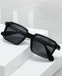 Detailed macro view of square frame sunglasses with silver metal rivets on the side
