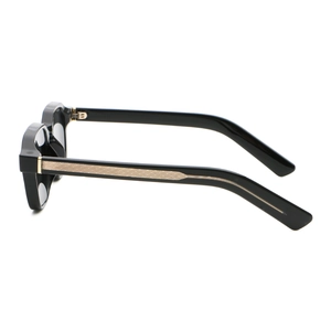Detail of black PC sunglasses featuring a gold woven diamond pattern on the metal temples