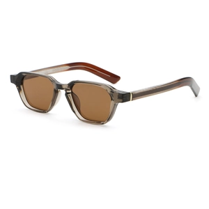 Detailed view of translucent grey-brown geometric PC frames and gold metal hinge accents