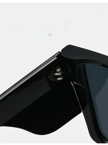 Macro view of durable metal hinges on black frame cycling sunglasses for long-term use