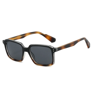 Modern square frame sunglasses with amber tortoise shell accents on dark grey lenses