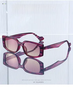 Detailed macro view of square purple textured sunglasses with gradient lenses