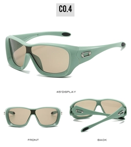 Detail view of oversized sports sunglasses in sage green with silver temple accents