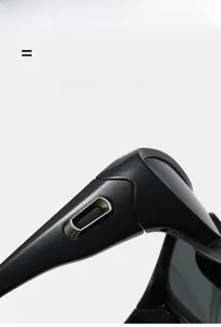 Macro detail of glossy black sports sunglasses hinge with metallic silver accents