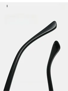 Detail of curved ergonomic temple tips on black oval sunglasses for comfortable wear