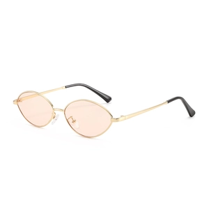 Retro small oval sunglasses with gold metal frame and stylish pink transparent lenses