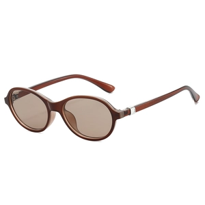 Retro oval tortoiseshell sunglasses with amber frames and brown lenses for a vintage look