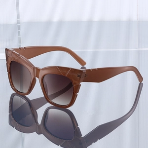 Fashionable dark brown cat-eye sunglasses with thick frames and gradient lenses