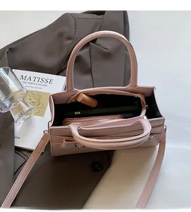 Top view of pink leather tote bag interior showing spacious storage for essentials