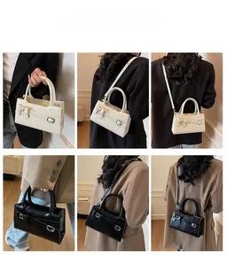 Detailed views of crossbody bags in black and cream featuring stylish bow decorations