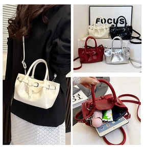 Detailed view of spacious interior holding iPad and phone in vintage crossbody bag
