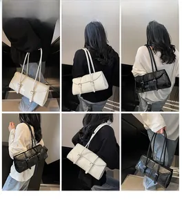 Detailed views of stylish black and white shoulder bags with dual straps and sleek metal buckles