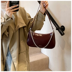 Detail of dark burgundy retro hobo bag with NO FILTER print and silver chain link