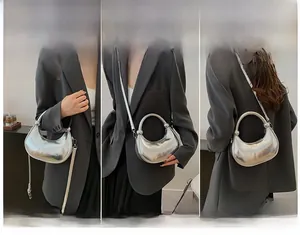 Detailed views of a silver crescent handbag showing handheld, crossbody and shoulder styles