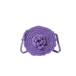 Handmade purple crochet crossbody bag featuring a stylish 3D woven rose flower design