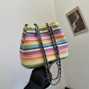 Rainbow striped woven bucket bag with elegant metal chain straps for summer vacations